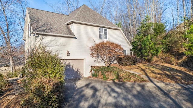 view of property exterior with a garage