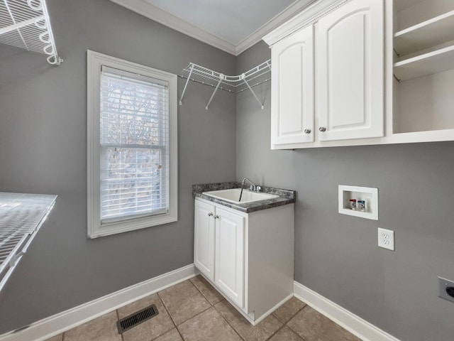 laundry room featuring sink, crown molding, cabinets, washer hookup, and hookup for an electric dryer