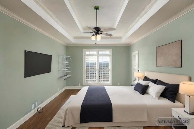 bedroom with dark hardwood / wood-style flooring, crown molding, a raised ceiling, and ceiling fan