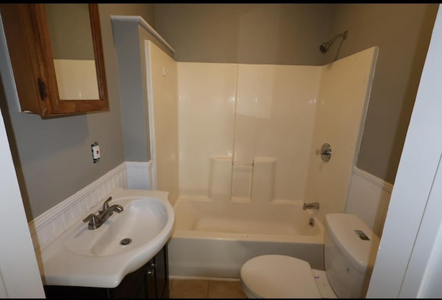 full bathroom featuring bathtub / shower combination, toilet, and sink