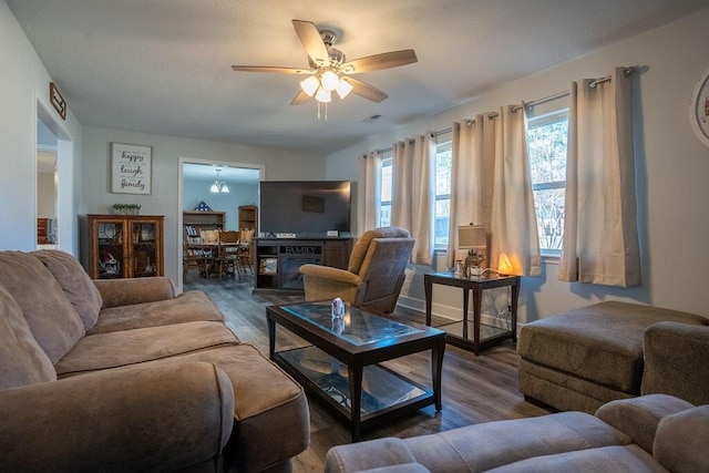 living room with hardwood / wood-style flooring and ceiling fan