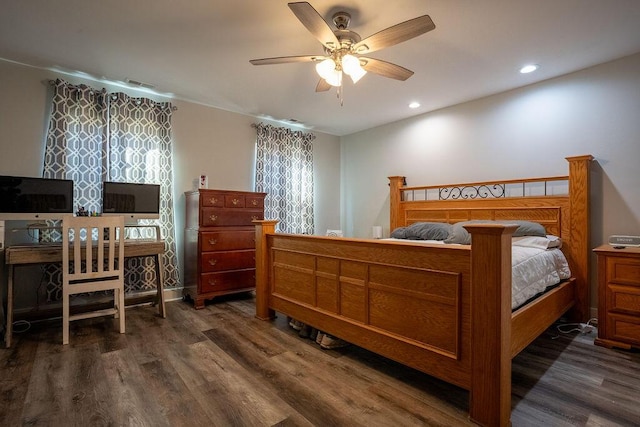 bedroom featuring dark hardwood / wood-style floors and ceiling fan