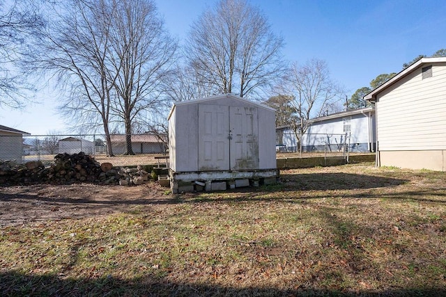 view of outdoor structure featuring a lawn