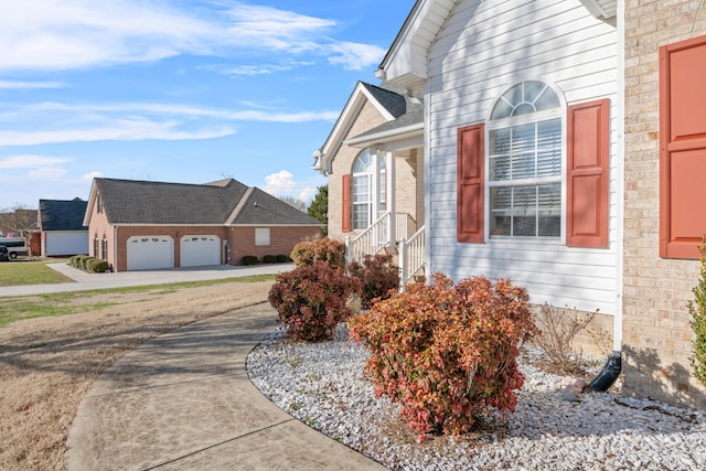 view of side of home with a garage