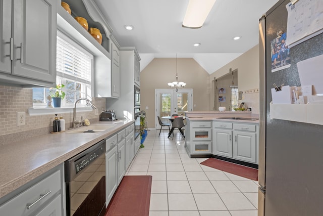 kitchen featuring sink, black appliances, gray cabinetry, and decorative light fixtures