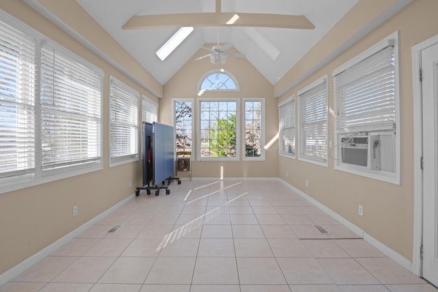 unfurnished sunroom with ceiling fan, cooling unit, and lofted ceiling with skylight