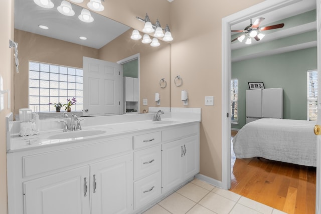 bathroom featuring tile patterned floors, vanity, and ceiling fan