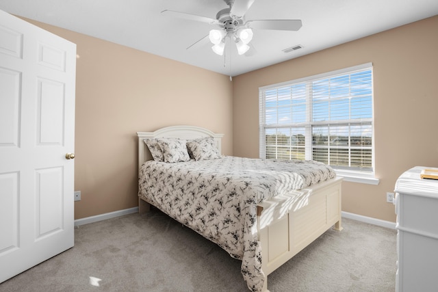 bedroom with light carpet and ceiling fan