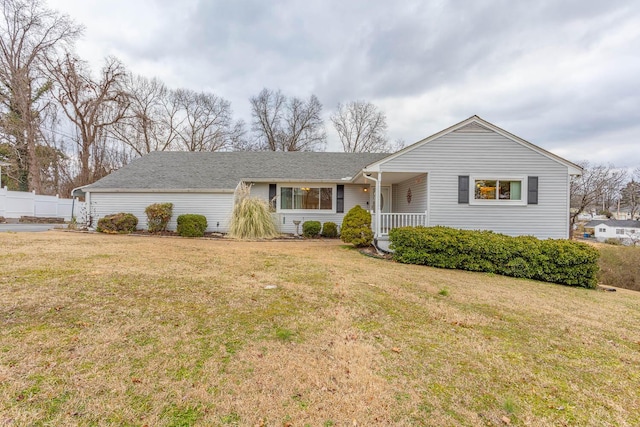 ranch-style home with a front lawn