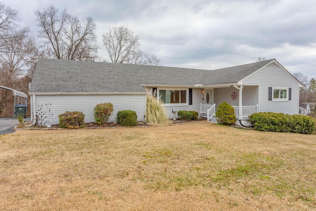 ranch-style house featuring covered porch and a front yard