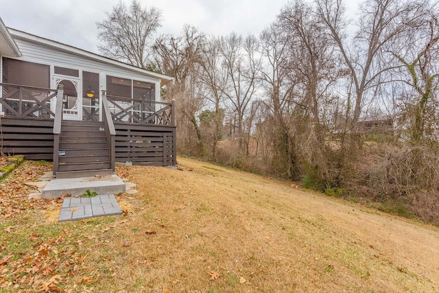 view of yard featuring a sunroom