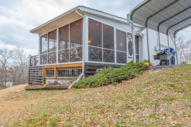 view of property exterior with a lawn and a sunroom