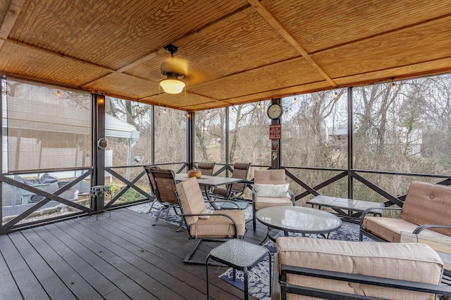 unfurnished sunroom featuring wood ceiling