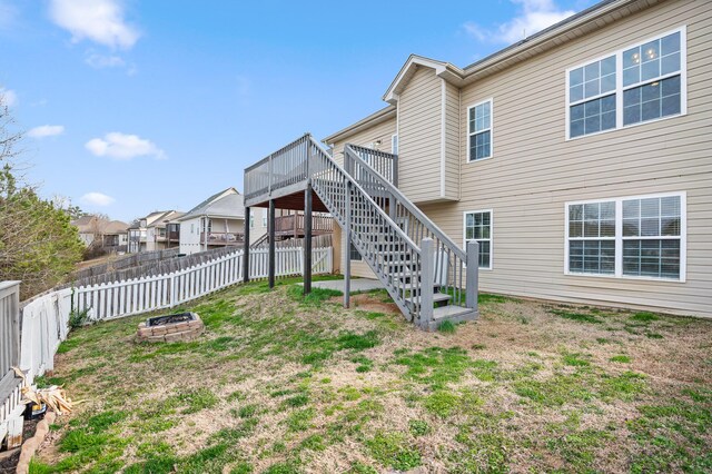 8500 Standifer Gap Rd, Chattanooga, TN 37421 - back of house featuring a fenced backyard, a lawn, a wooden deck, and stairs