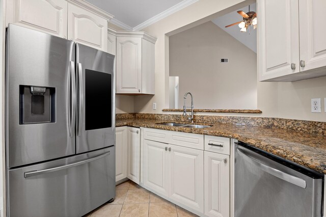 8500 Standifer Gap Rd, Chattanooga, TN 37421 - kitchen with stainless steel appliances, ornamental molding, light tile patterned flooring, a sink, and white cabinetry