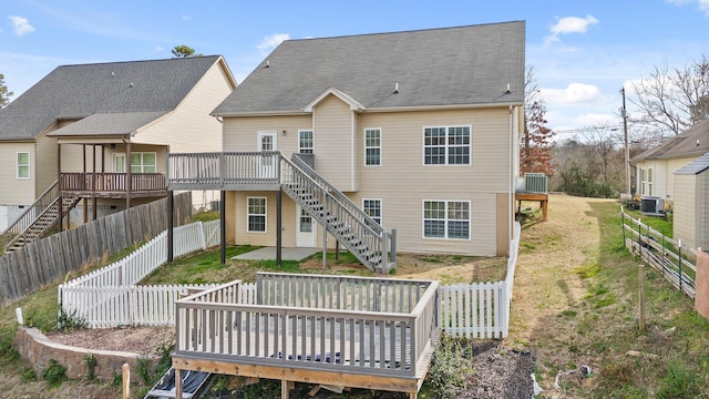 8500 Standifer Gap Rd, Chattanooga, TN 37421 - rear view of house featuring central AC unit, a lawn, a fenced backyard, stairs, and a wooden deck