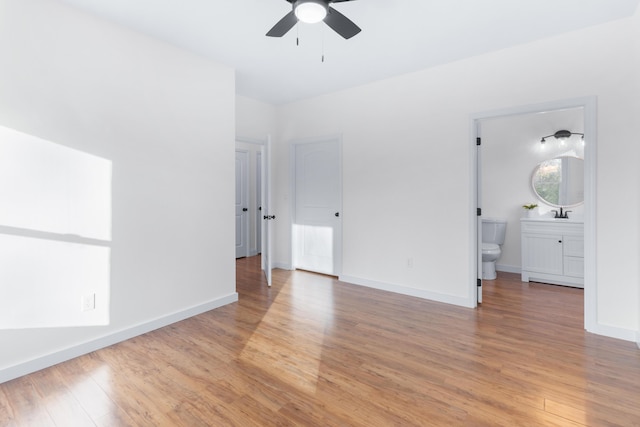 unfurnished room featuring ceiling fan and light hardwood / wood-style floors