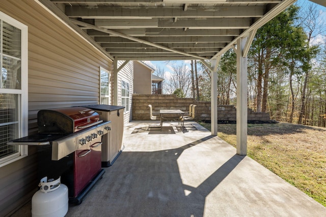 view of patio featuring fence