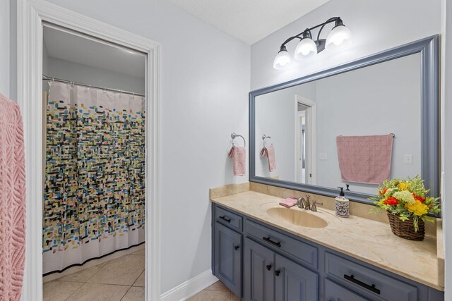 full bathroom featuring tile patterned flooring, vanity, and a shower with shower curtain