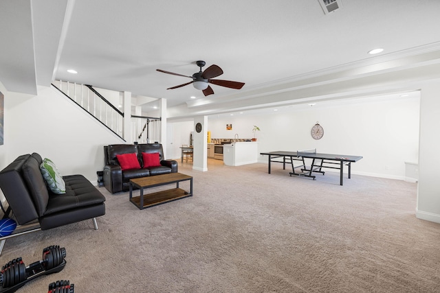 living area featuring recessed lighting, visible vents, light carpet, and stairs