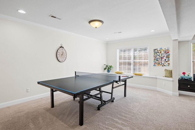 playroom featuring light carpet, visible vents, baseboards, ornamental molding, and plenty of natural light