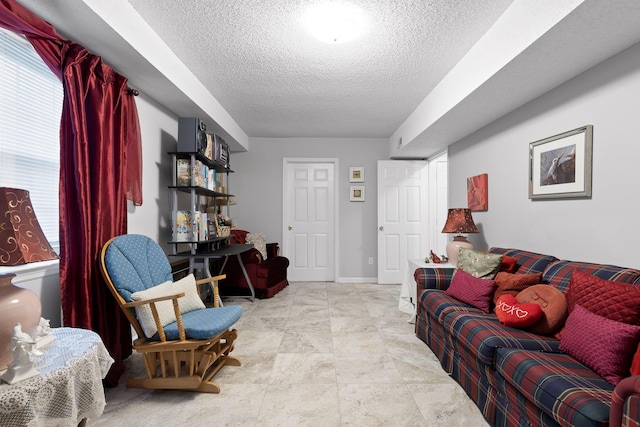 living room with a textured ceiling