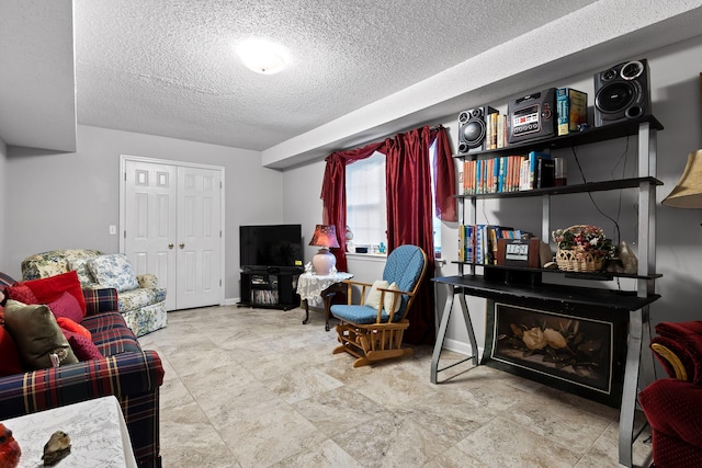 living room with a textured ceiling