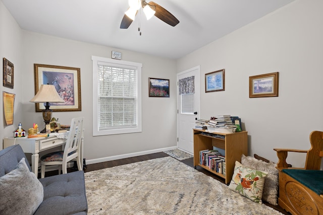 office space with ceiling fan and dark hardwood / wood-style flooring