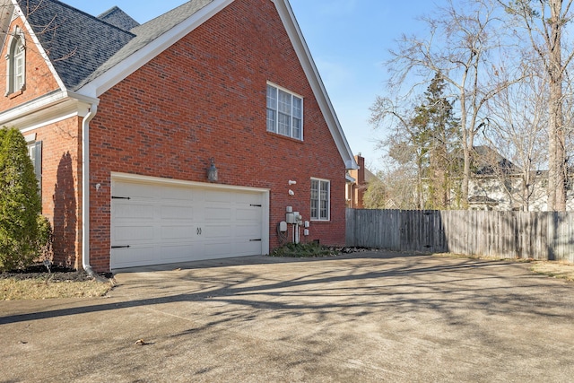 view of side of home featuring a garage