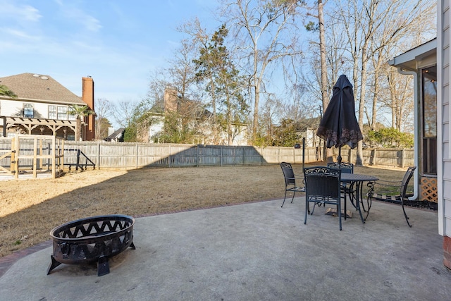 view of patio / terrace with an outdoor fire pit