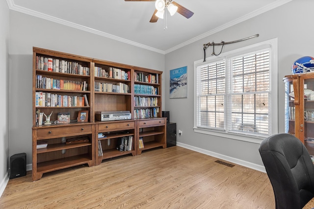 office with crown molding, light hardwood / wood-style flooring, and ceiling fan