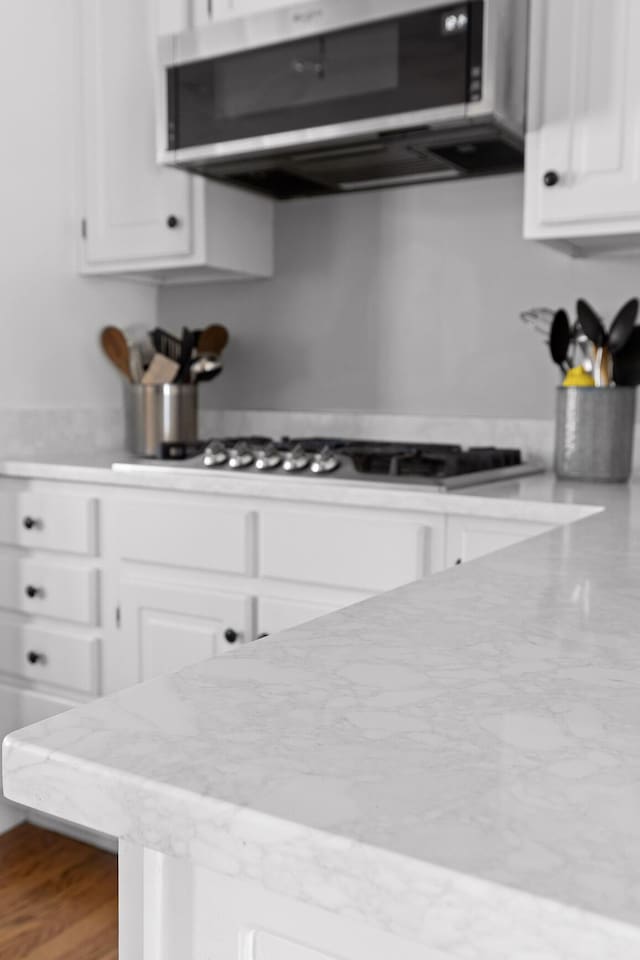 kitchen with stainless steel appliances and white cabinets