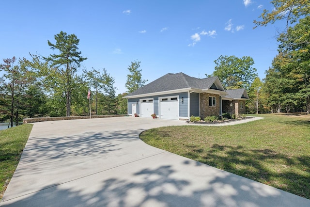 view of front of property featuring a garage and a front yard