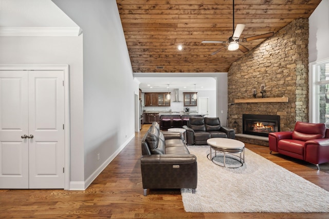 living room with a fireplace, wooden ceiling, dark hardwood / wood-style floors, and ceiling fan