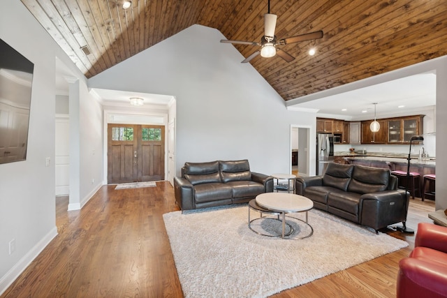 living room with ornamental molding, dark hardwood / wood-style floors, wooden ceiling, and high vaulted ceiling