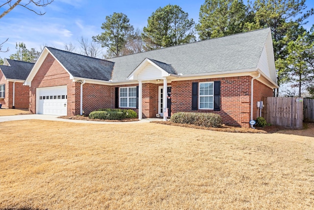 view of front facade featuring a garage and a front lawn