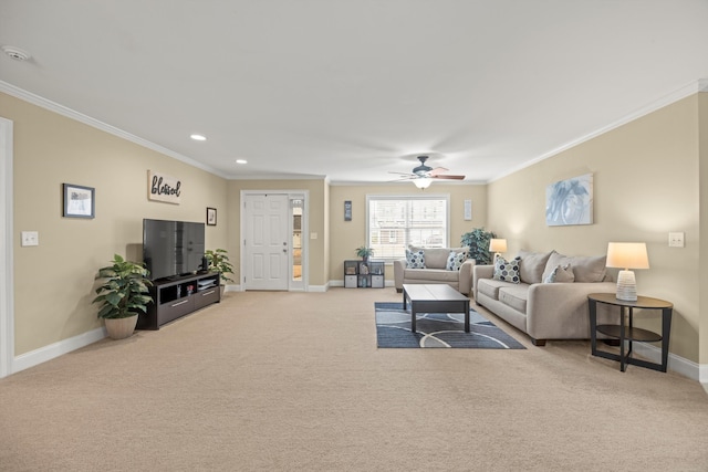 living room featuring crown molding, light colored carpet, and ceiling fan