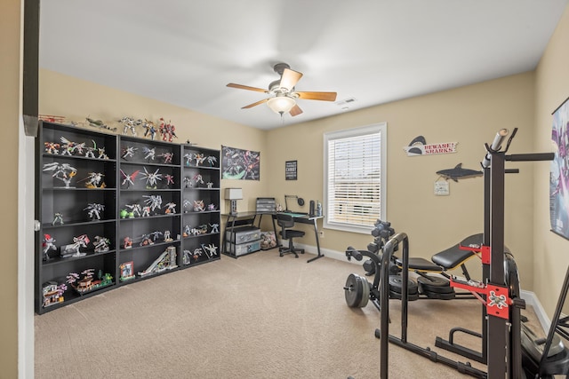 workout room with ceiling fan and carpet floors