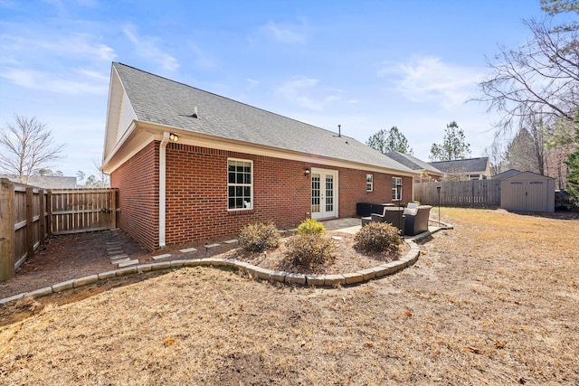 back of house featuring an outdoor hangout area, a patio area, a shed, and french doors