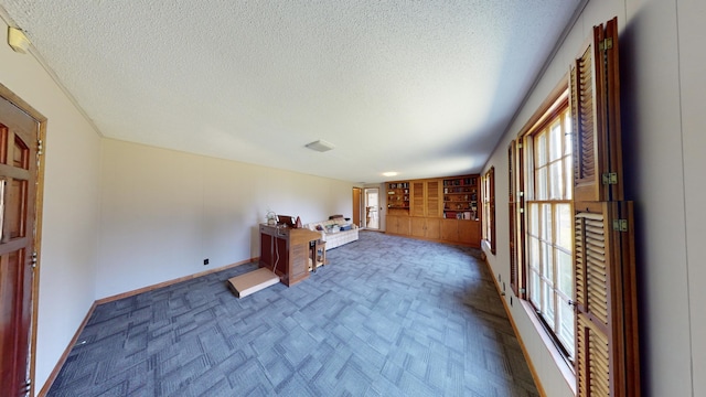 interior space with a textured ceiling