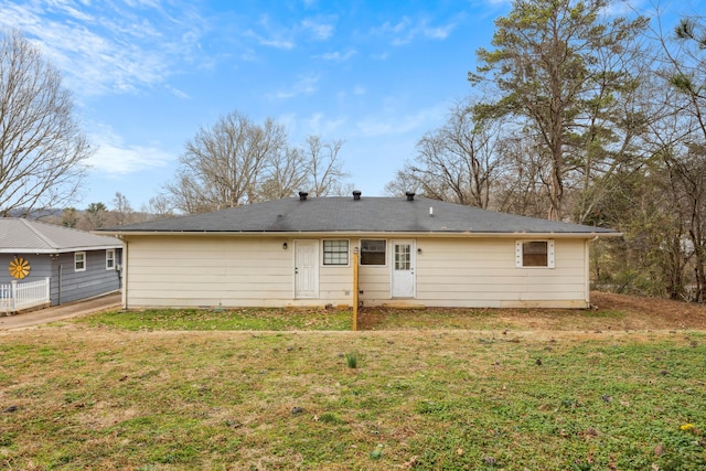 back of house with a yard