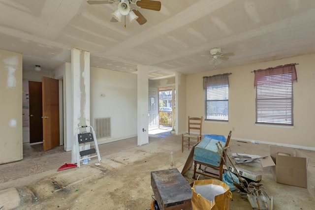 interior space with ceiling fan