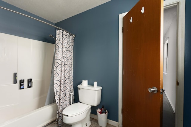 bathroom with shower / bath combination with curtain, toilet, and a textured ceiling