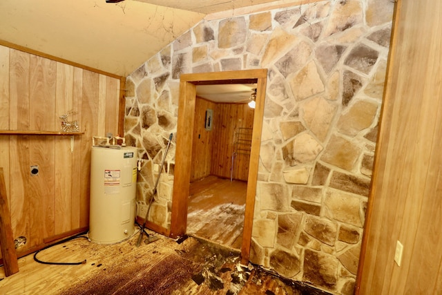 corridor with lofted ceiling and electric water heater