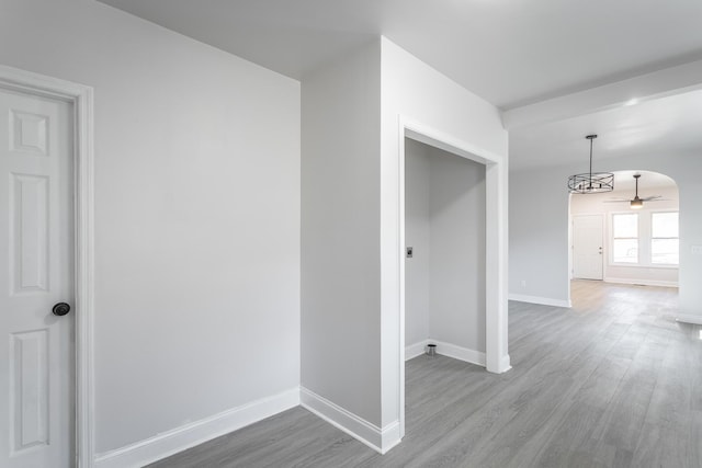 hallway with hardwood / wood-style floors