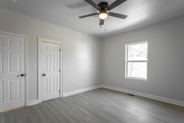 unfurnished bedroom with wood-type flooring and ceiling fan