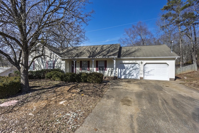 single story home with a garage and covered porch