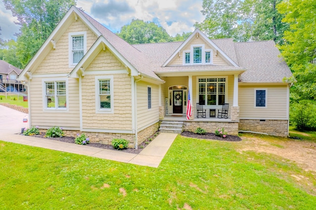 view of front of house featuring a porch and a front yard