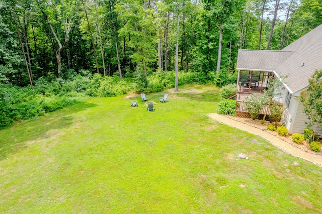 view of yard featuring a gazebo, a deck, and a fire pit