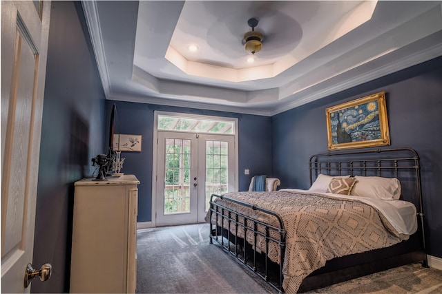 bedroom featuring french doors, a tray ceiling, ceiling fan, access to exterior, and carpet